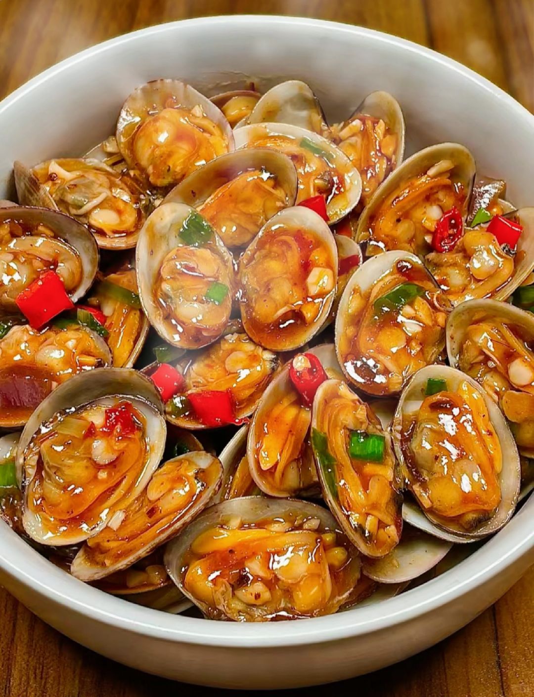 爆炒花甲家常做法视频(爆炒花甲的做法视频教程)